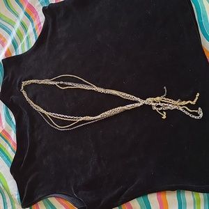 28" necklace w added chain attached of 4".  Silver,gold, bronze and black chains